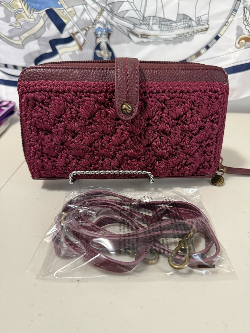 The Sak Woven Zip-Around Crossbody Wallet in Berry